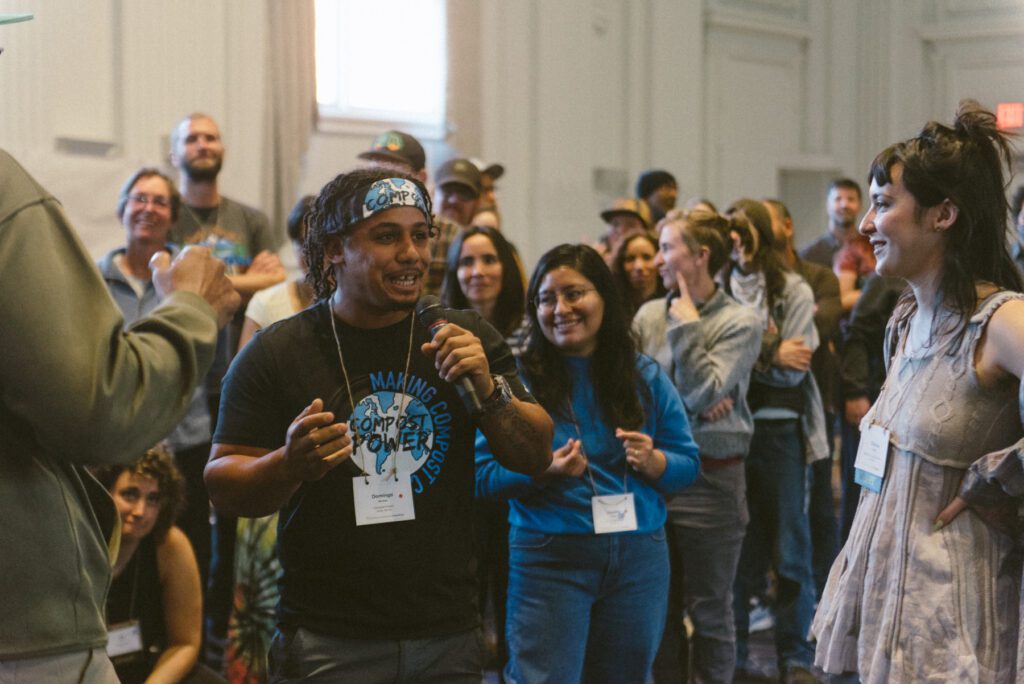 Community composter Domingo Morales engages with the audience at our 8th Annual Cultivating Community Composting Forum, with ILSR’s Clarissa Libertelli (right) looking on. Photo credit: Steven Springer