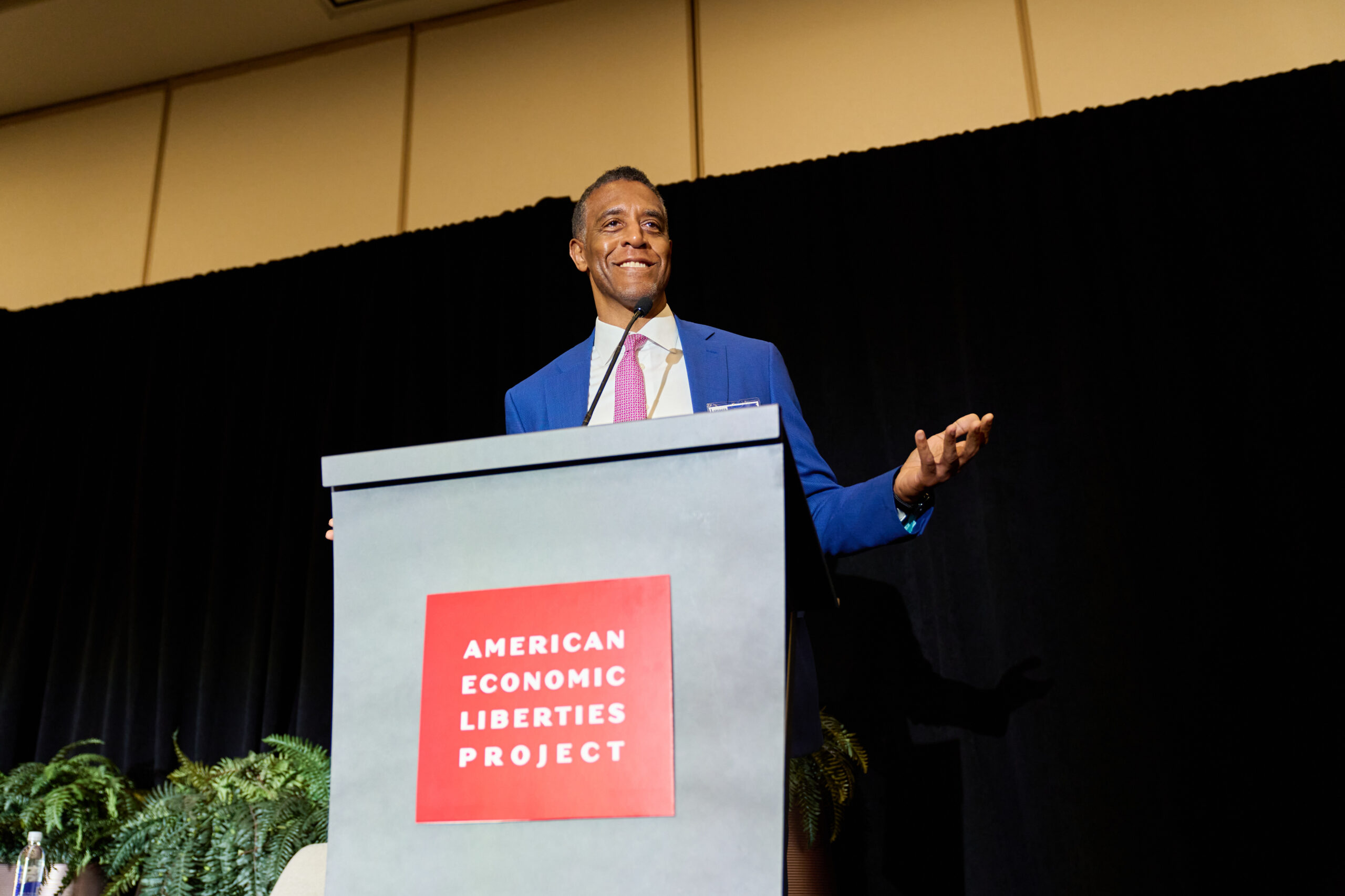 Speaker for the American Economic Liberties Project at a podium